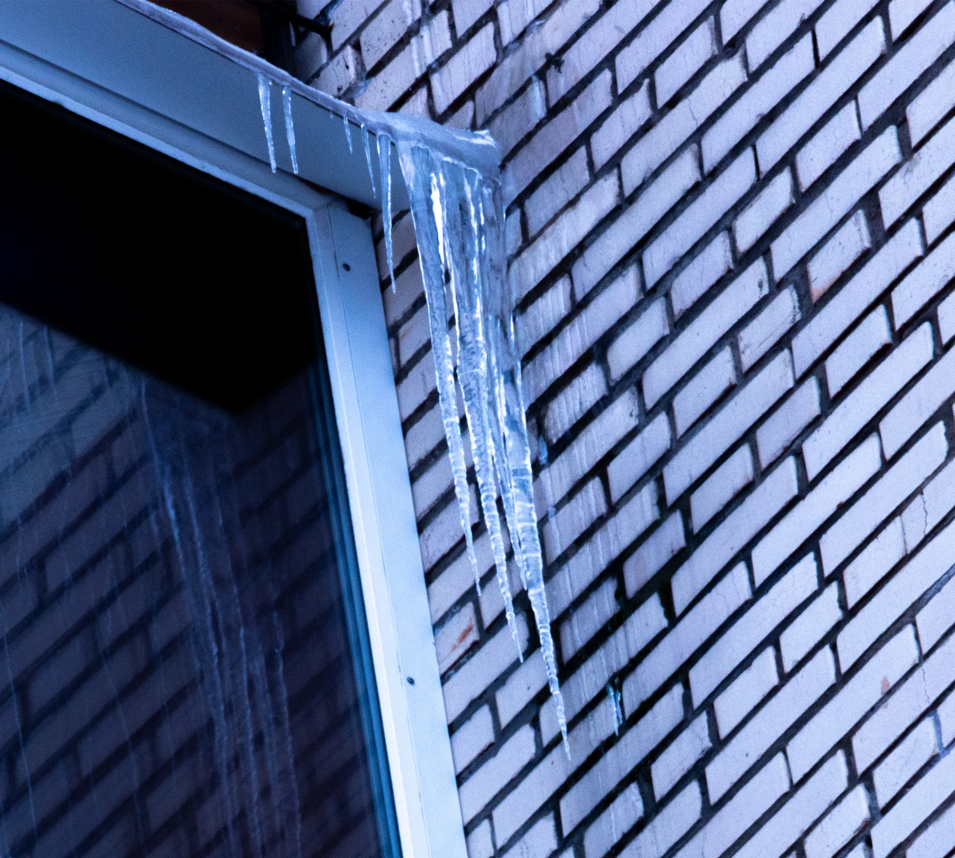 Ice buildup on a facade photographed from 40 metres
