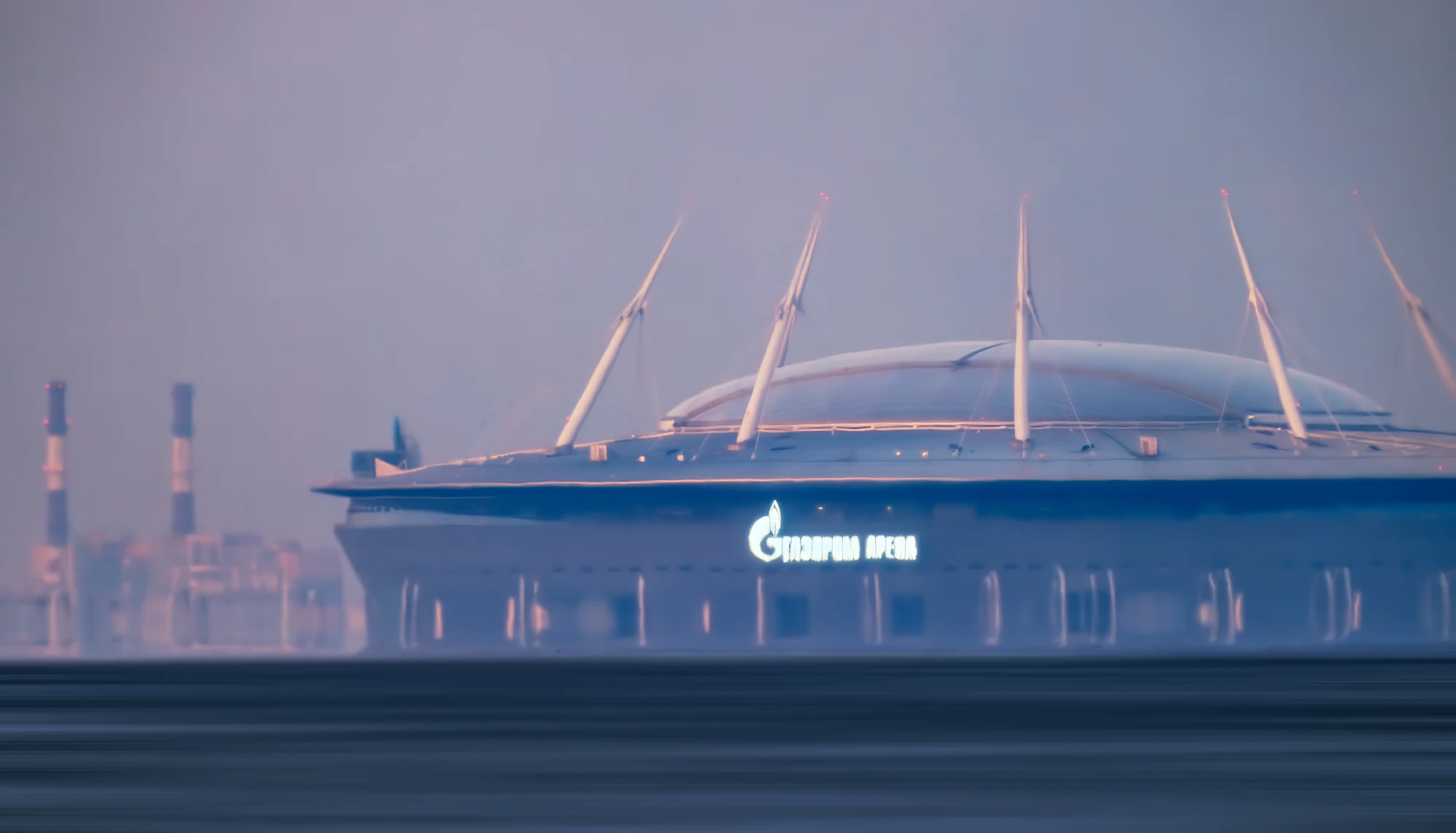 Stadium photographed through atmospheric haze from 25 kilometres